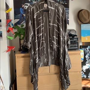 Soft shawl with fringe and rolled sleeves